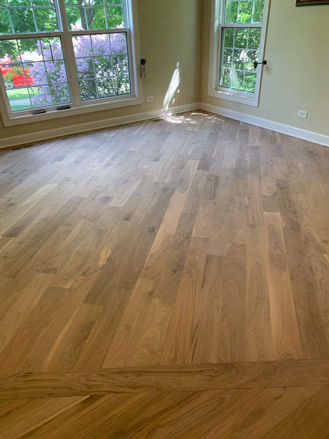 Dining room hardwood floor before restoration